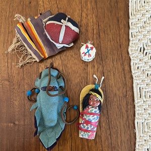 Two Skookum Doll papoose babies and assorted accessories